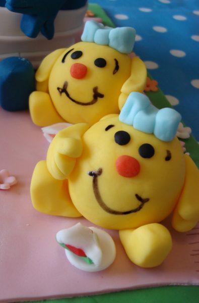 Mr Men and little miss Birthday cake sitting at a picnic