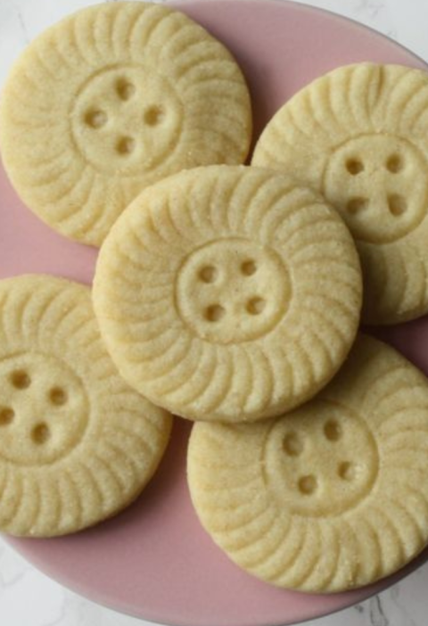 PLate of Almond shortbread recipe made with a cute button cookie cutter