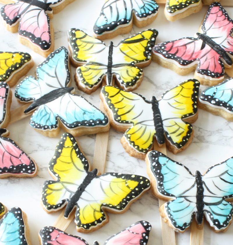 Painted butterfly cookies on sticks